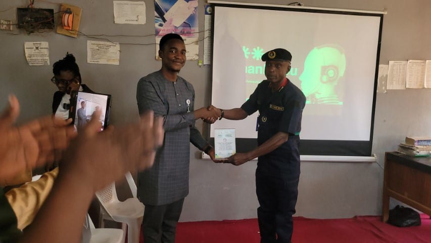 A Toko Academy trainer and an officer of a partner institution at the close of a corporate programme in Yola